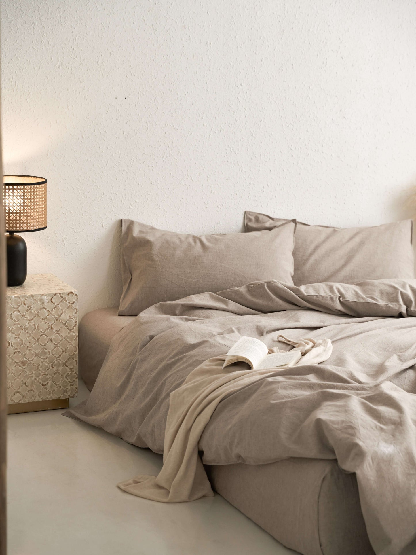 Neutral latte linen bedding with natural textured weave.