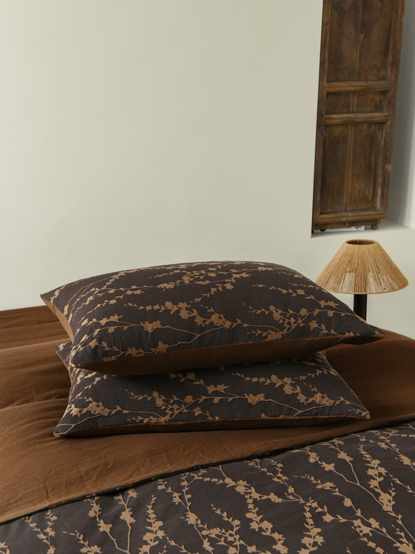Cocoa Vine Bedding Set featuring brown vine patterns on pillows, perfect for earthy modern bedroom decor.