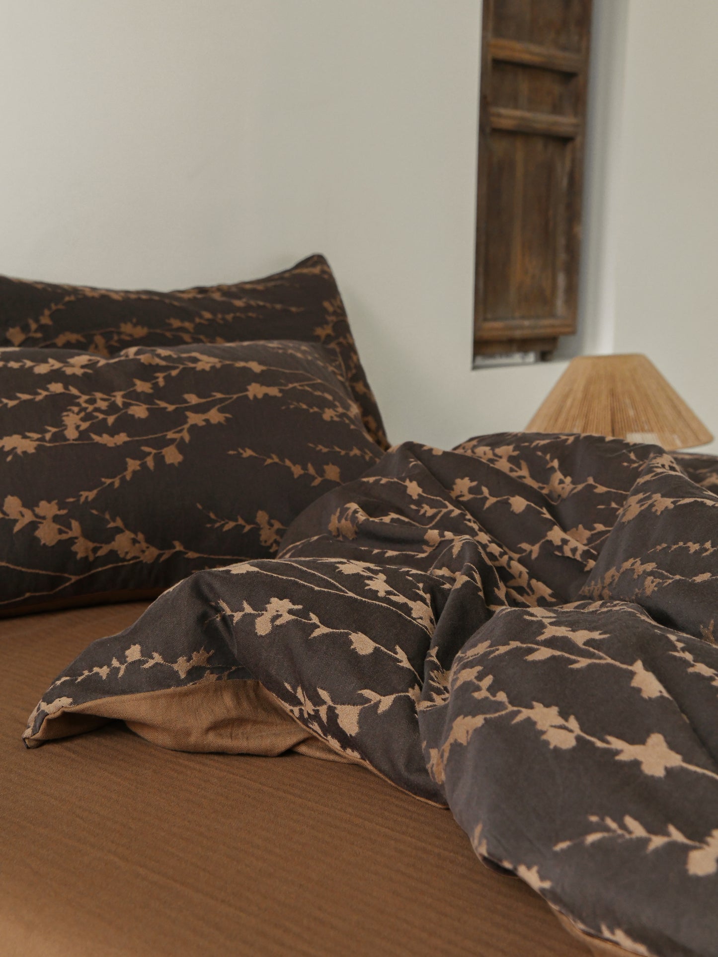 Brown bedding set with intricate vine pattern for a natural, organic look