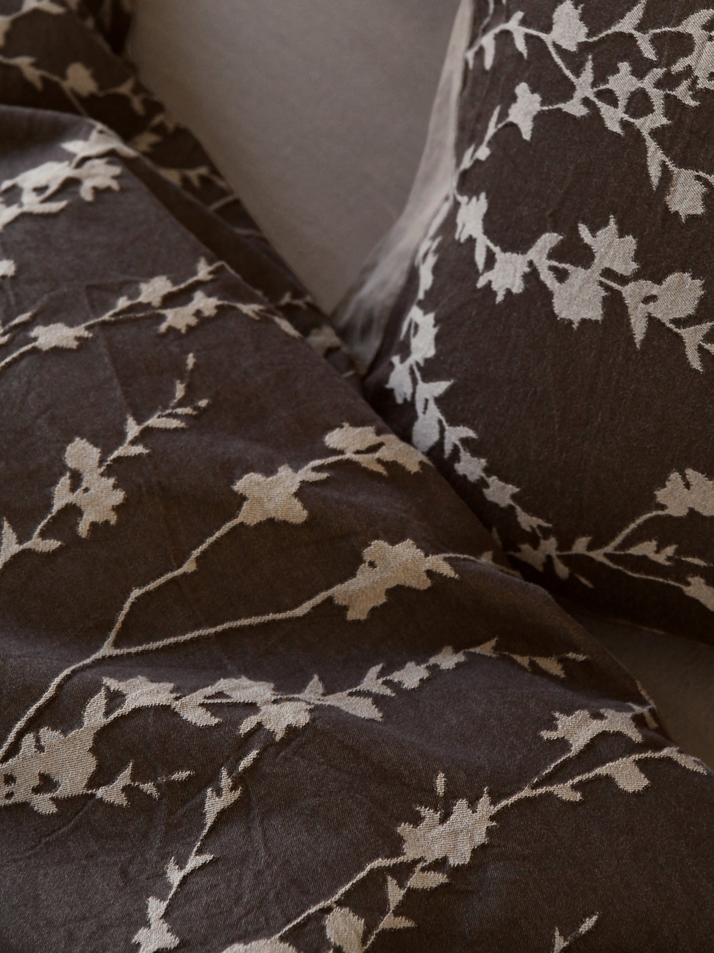 Taupe vine bedding set with a delicate floral pattern, providing an organic and sophisticated look for your bedroom.