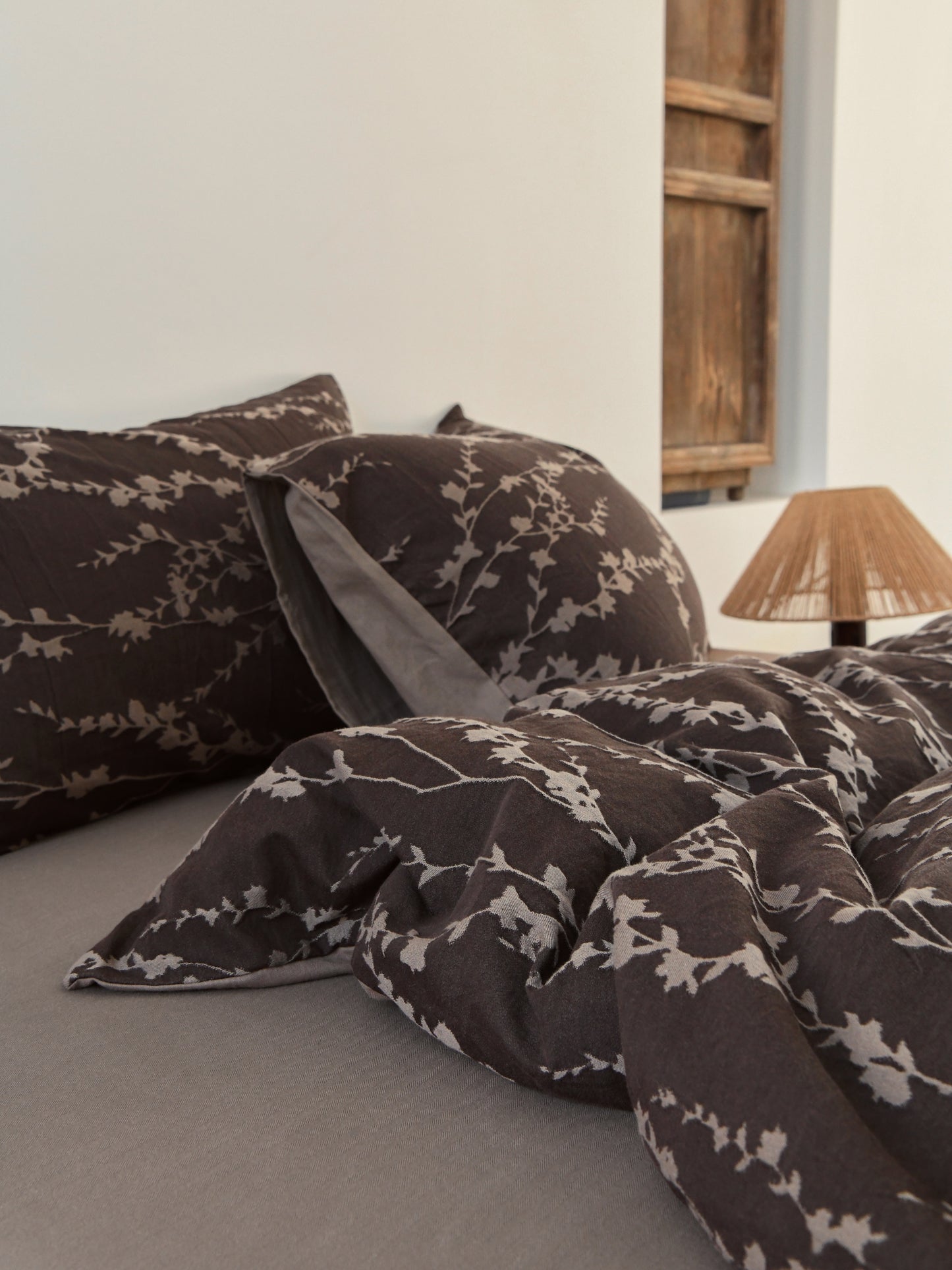 Taupe vine bedding set featuring elegant vine patterns on pillows and duvet, creating a sophisticated and organic bedroom aesthetic.