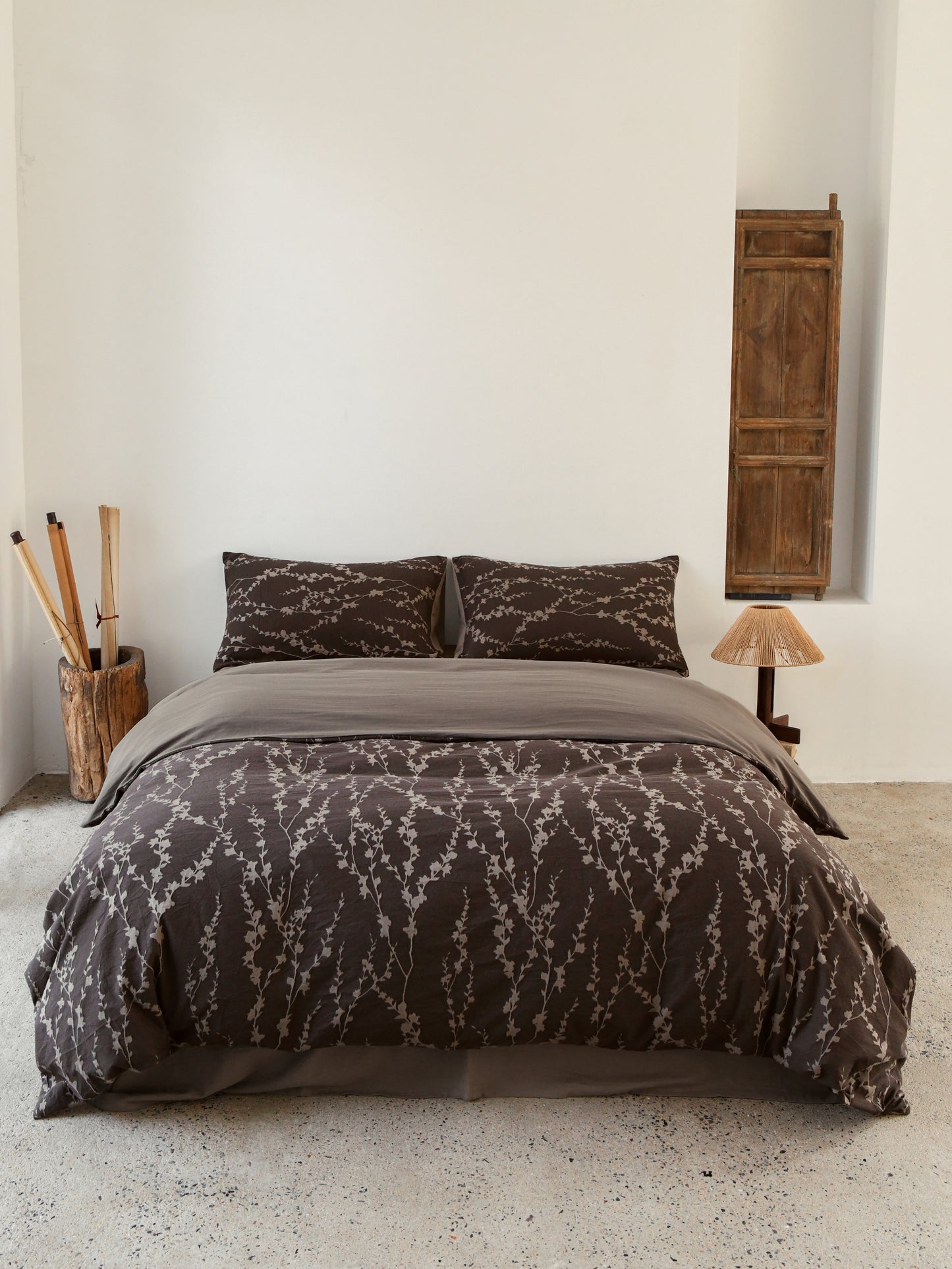 Taupe vine bedding set on a stylish bed, featuring an elegant and organic design for a tranquil bedroom atmosphere.
