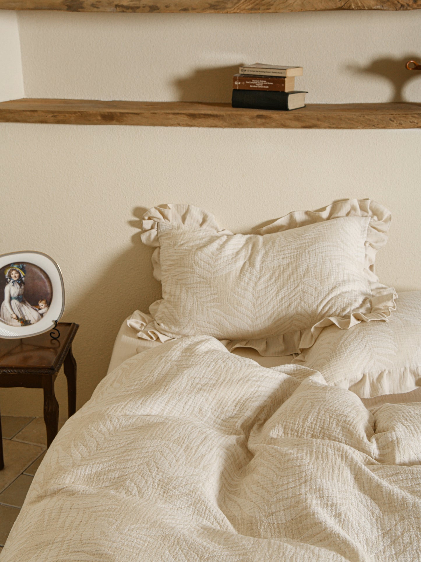 Neutral beige linen duvet with tonal floral embroidery.