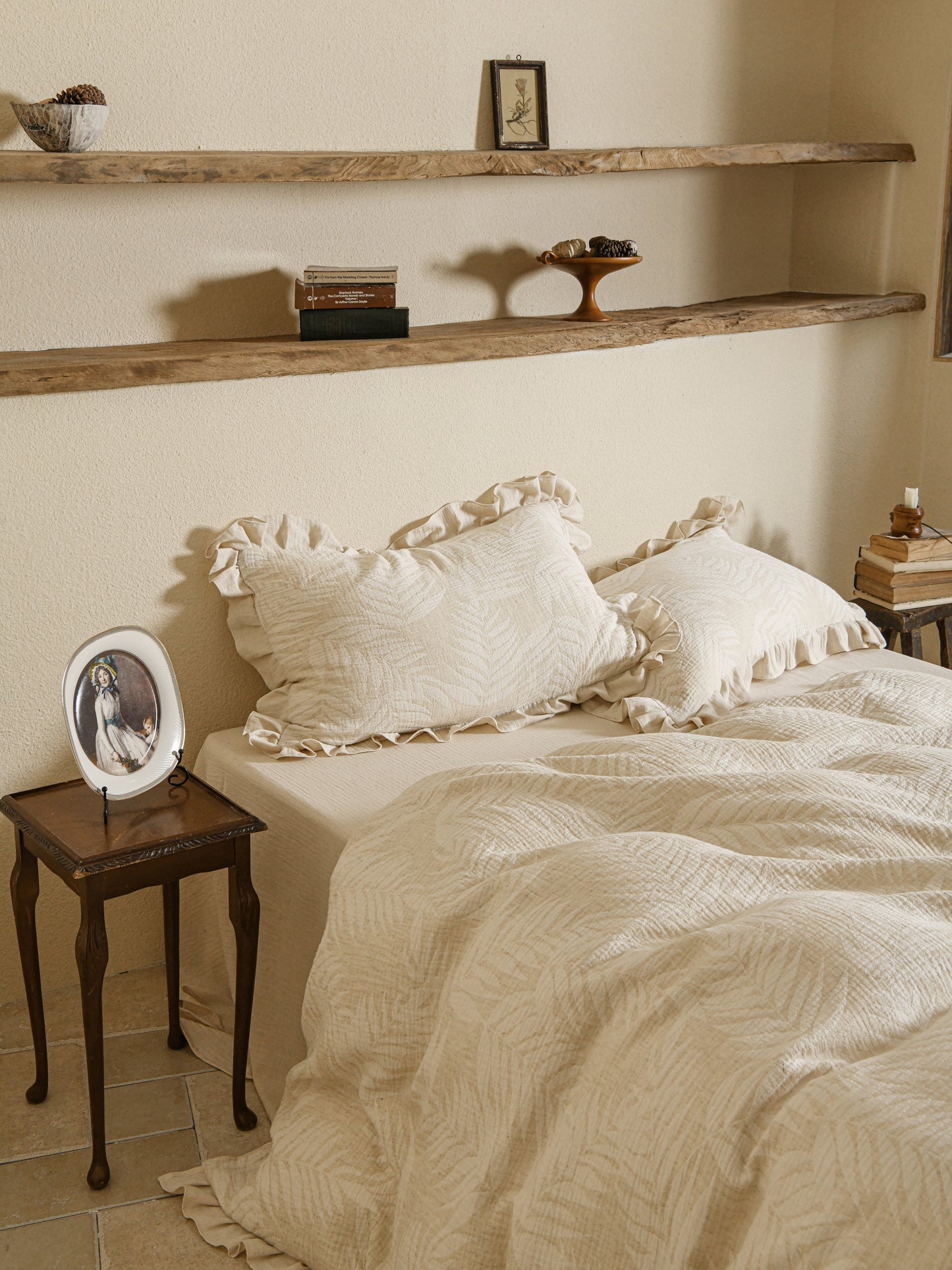 Neutral beige linen duvet with tonal floral embroidery.