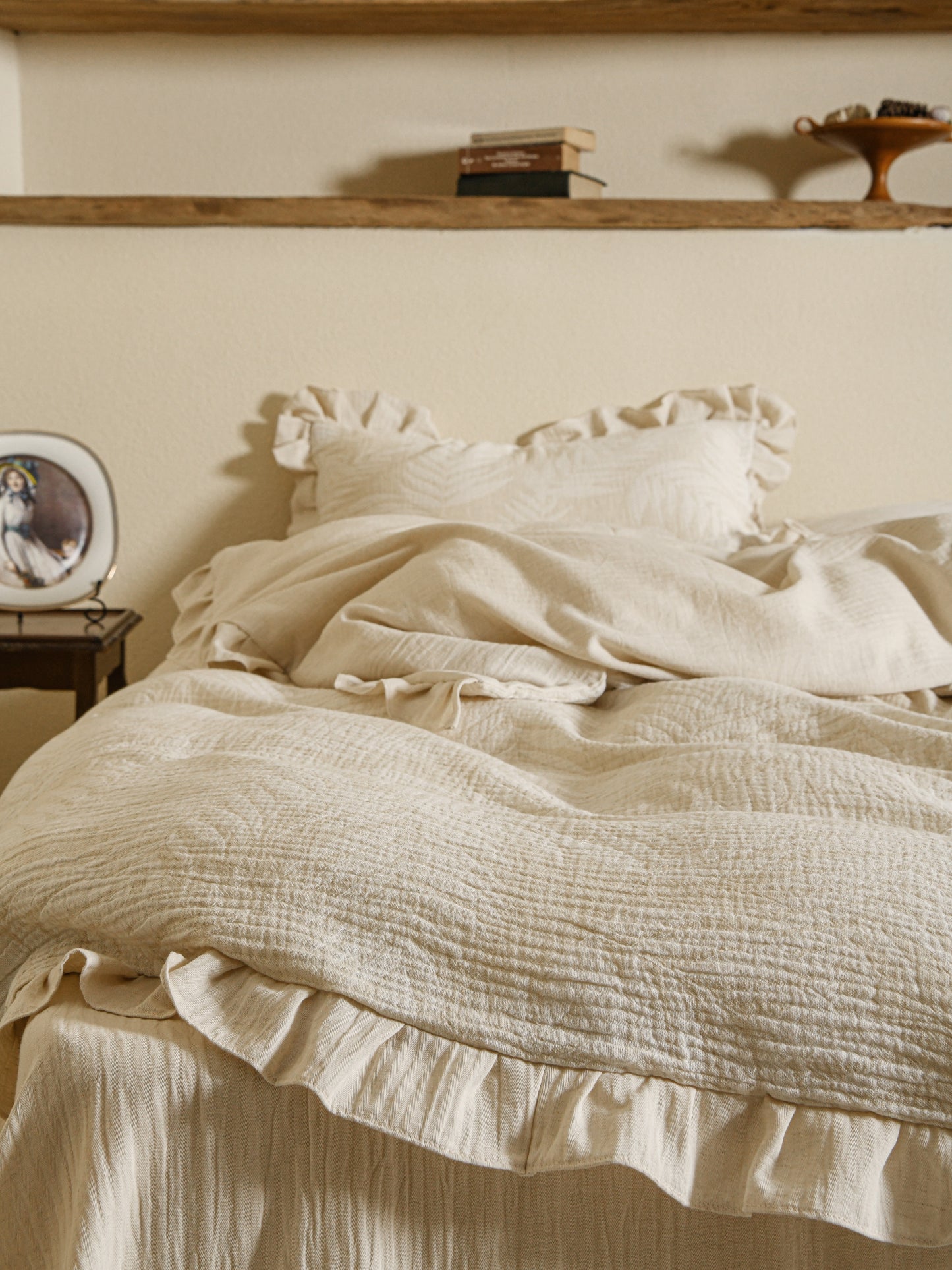 Neutral beige linen duvet with tonal floral embroidery.