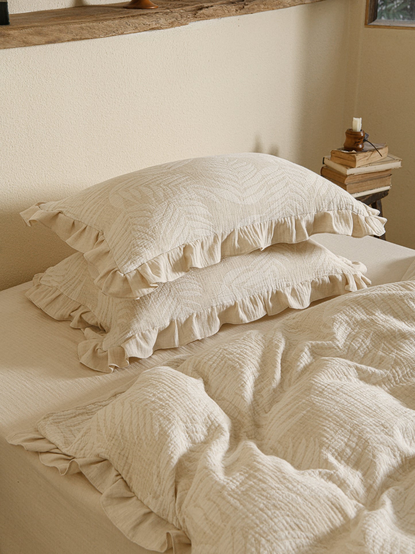 Neutral beige linen duvet with tonal floral embroidery.