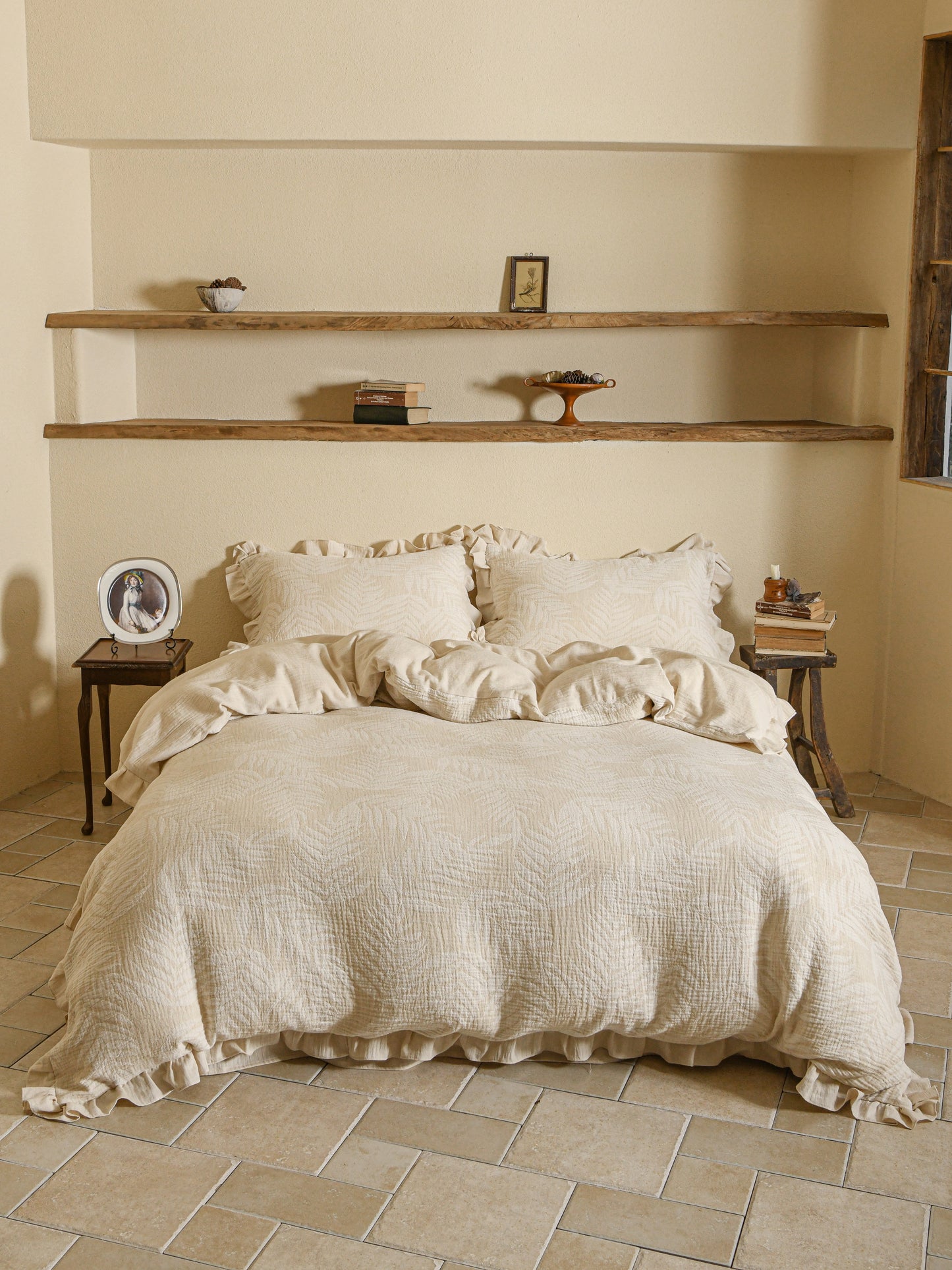 Neutral beige linen duvet with tonal floral embroidery.