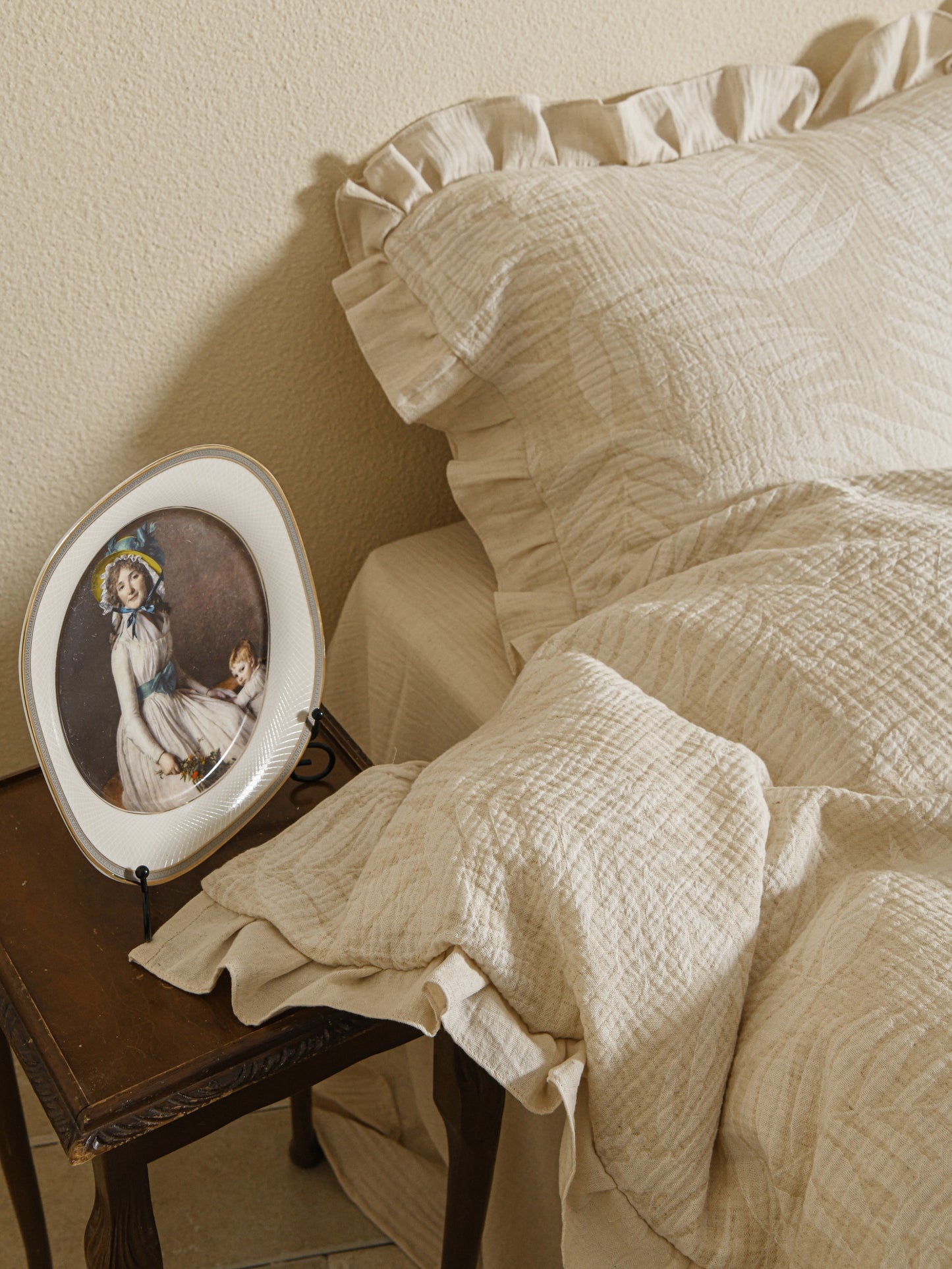 Neutral beige linen duvet with tonal floral embroidery.