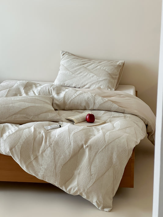 Neutral beige duvet with tonal wave texture in 100% premium cotton.
