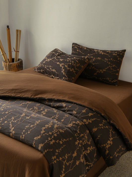 Cocoa Vine Bedding Set featuring brown vine patterns and matching pillows, ideal for earthy modern bedroom decor.