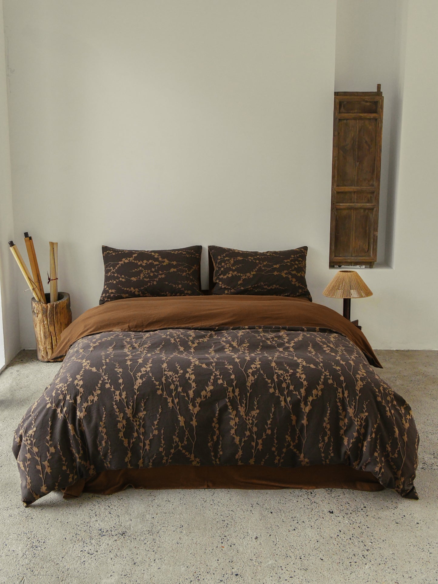 Cocoa Vine Bedding Set featuring brown vine-patterned duvet and pillowcases, styled with earthy modern décor.