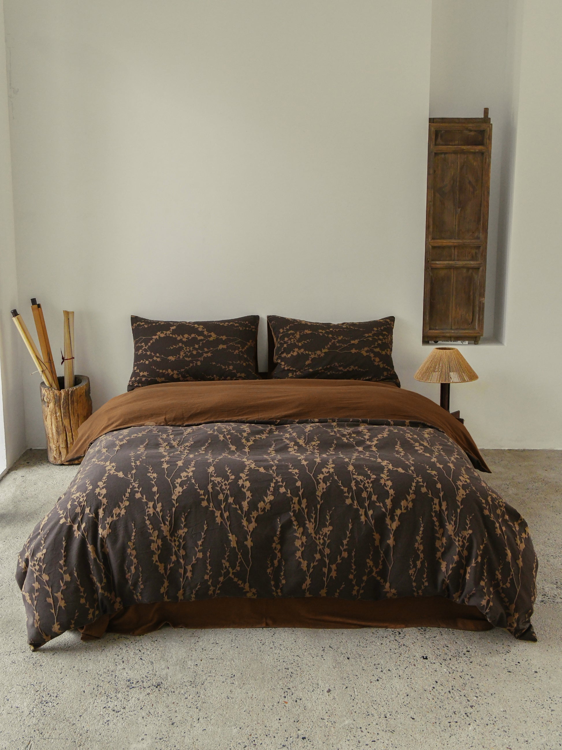Cocoa Vine Bedding Set featuring brown vine-patterned duvet and pillowcases, styled with earthy modern décor.